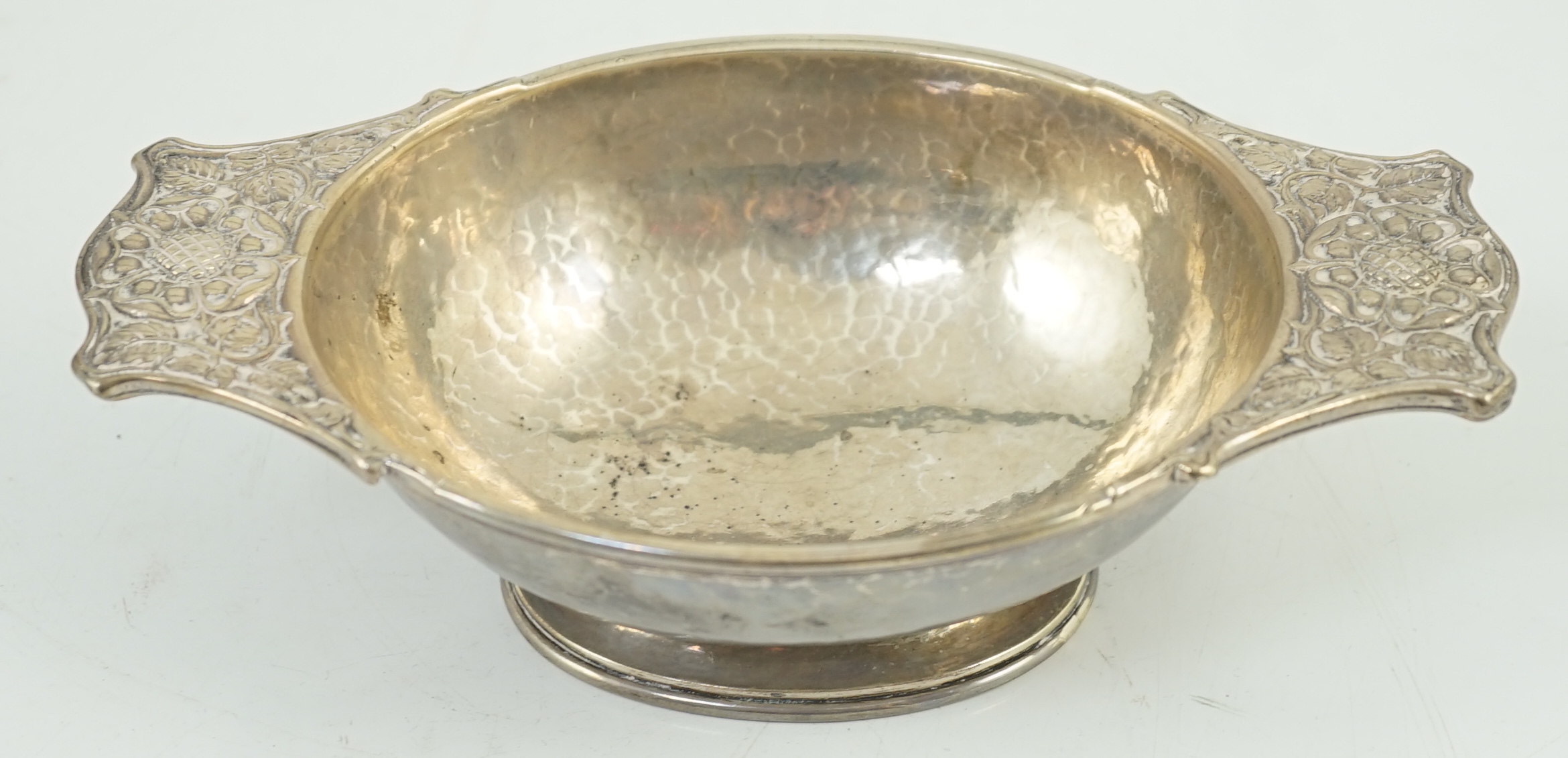 A George V Arts & Crafts planished silver two handled oval bowl by Omar Ramsden